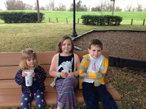 Olivia (in the middle), sitting at the park with her cousins. I can't believe she's nine already!